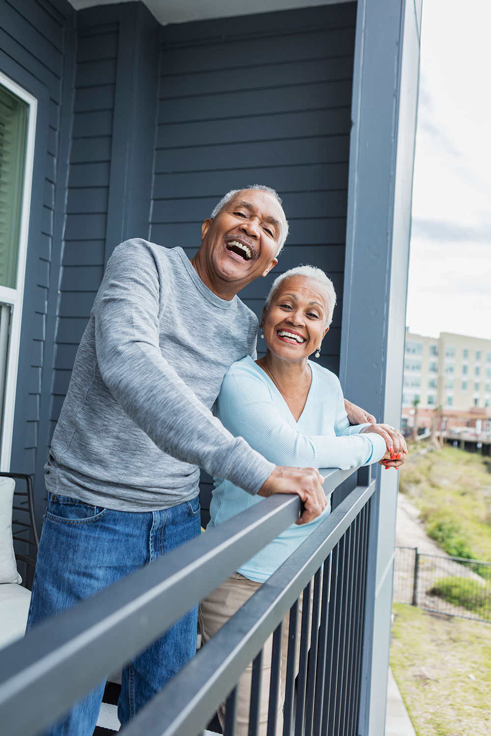 Happy couple living in HOA community